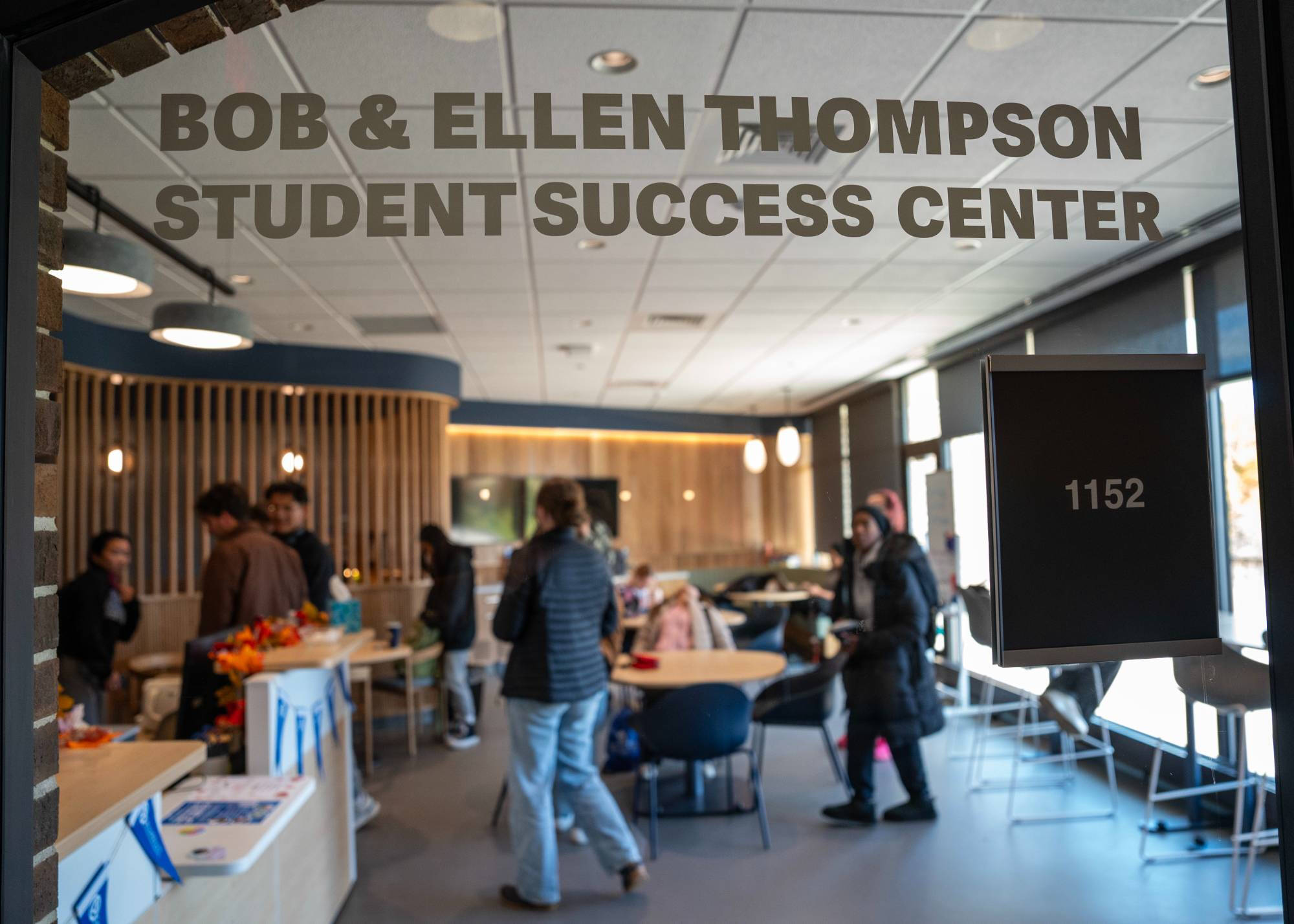 Looking in on students in the Thompson Student Success Center through the glass outside